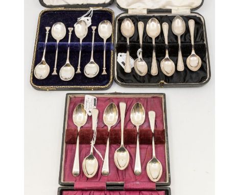 A collection of three cased sets of spoons to include; A Birmingham silver seal like topped set of six spoons, hallmarked 192