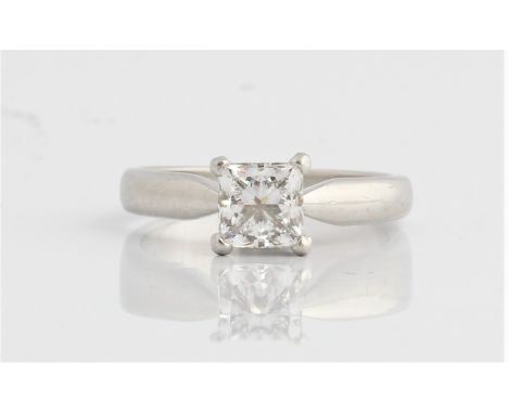 A hallmarked platinum diamond solitaire ring, set with a princess cut diamond measuring approx. 0.90ct, ring size K. IMPORTAN