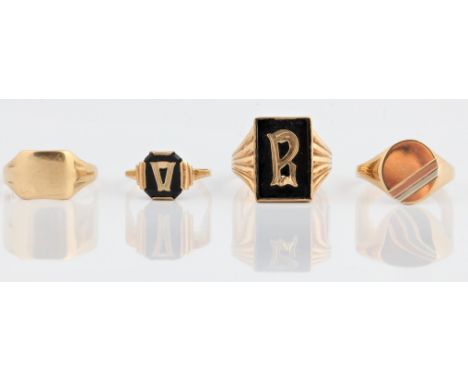 A selection of rings, to include a black hard stone mourning ring, stamped 9ct, ring size M½, a hallmarked 9ct yellow gold in