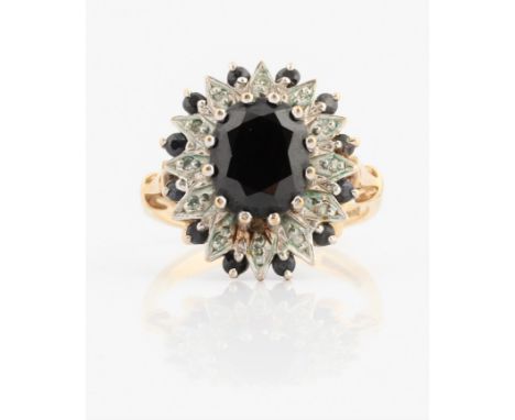 A hallmarked 9ct yellow gold sapphire and diamond cluster ring, ring size P½, weight approx. 5.5g. IMPORTANT: Online viewing 