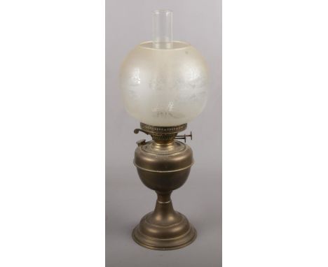 A Late 19th Century Oil Lamp by Veritas Lamp Works Co with brass reservoir &amp; glass shade  