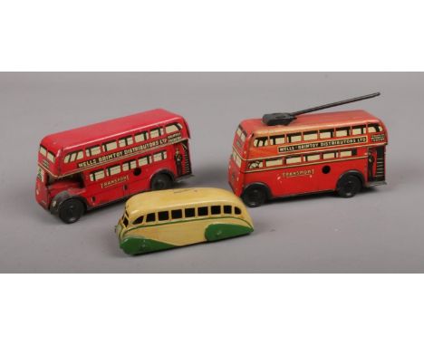 Two vintage tin plate Wells Brimtoy buses, along with a Mecanno Dinky diecast bus.  