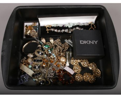 A tray of mixed costume jewellery including a DKNY bangle, cufflinks and necklets etc.  