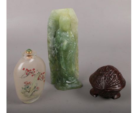 A jade coloured carving formed as Guanyin along with a wooden trinket box formed as a nut and a Chinese painted scent bottle 