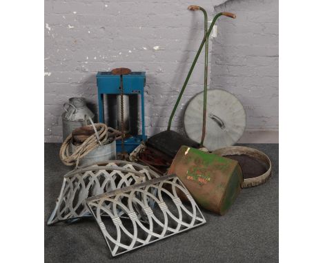 A group lot of mostly metalwares to include vintage push along lawn mower, large candlestick, etc.  