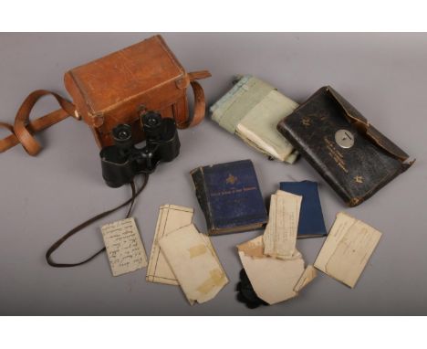 A pair of vintage binoculars in associated leather case, along with a Masonic leather wallet including a sash two Masonic boo