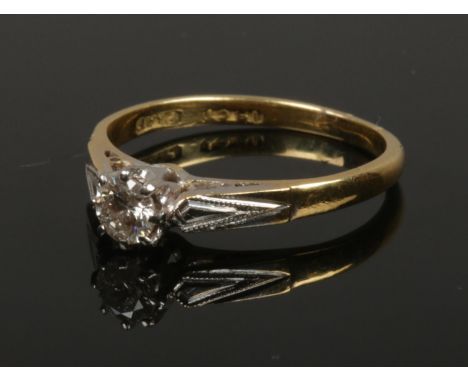 A mid 20th century 18ct gold and platinum diamond solitaire ring. Approximately 0.25ct, size K, 2.18g gross weight.  