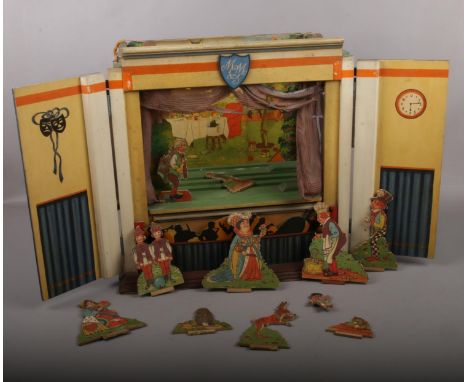 A 1950s Alice in Wonderland wooden Puppet Theatre, Juvenile Productions Ltd No 3803 back drop with wooden cut out figures. Cl