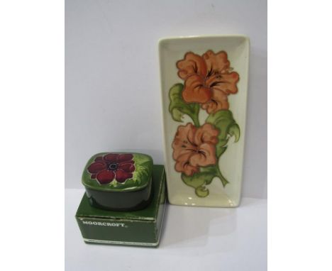 MOORCROFT, "Hibiscus" pattern rectangular pen tray and similar "Anemone" pattern green ground lidded trinket box 
