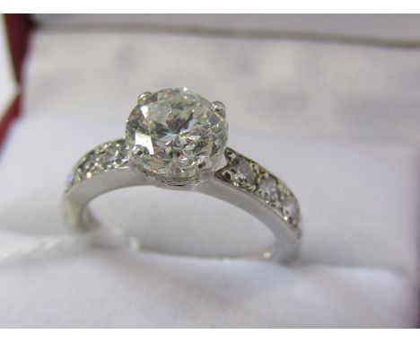 PLATINUM SET DIAMOND SOLITIAIRE RING, principal transitional brilliant cut diamond of good colour with 4 further diamonds to 