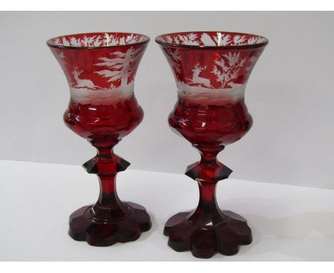 BOHEMIAN GLASS, pair of 19th Century etched ruby glass goblets, with decorated with stag hunts octagonal lobed base (1 with r