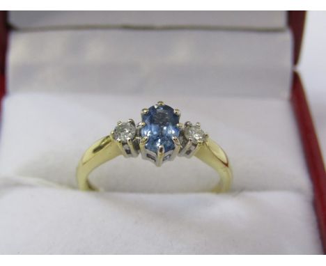 18ct YELLOW GOLD 3 STONE SAPPHIRE &amp; DIAMOND RING, principal pale blue oval cut sapphire with brilliant cut diamond to eac