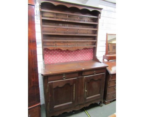 19TH CENTURY FRENCH DRESSER, open shelf plate rack with spindle gallery above twin cupboard and twin drawer base, carved scro