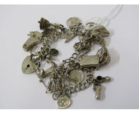 SILVER CHARM BRACELET, weighing approx. 51grms, various silver charms including grand piano, 18 key, horses head, water bottl