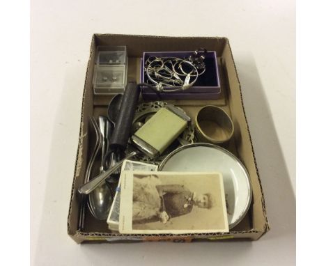 A tray of silver jewellery, tea spoons, serviette ring, a vesta case etc. 