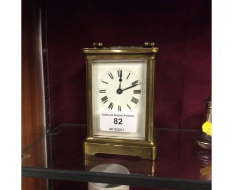 A Brass cased carriage clock with key 
