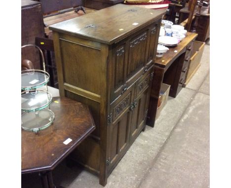 An Old Charm oak cocktail cabinet 