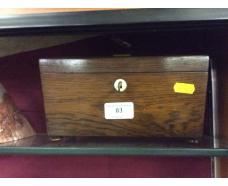 A 19th Century rosewood sarcophagus shaped tea caddy 