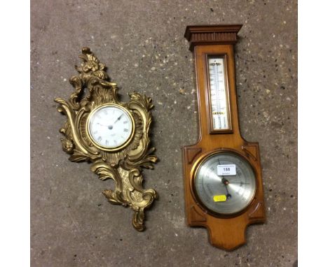 A Negretti & Zambra barometer; together with a gilt framed wall clock 