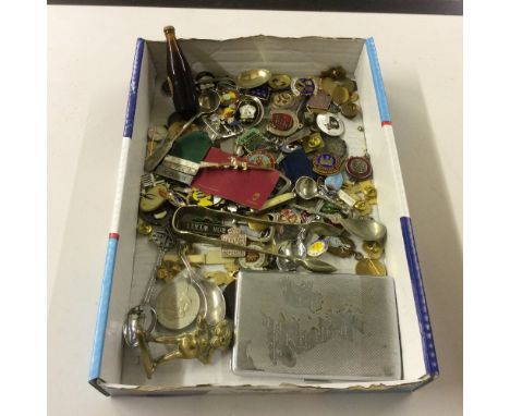 A tray of various badges; a pair of sugar tongs; a cigarette case etc. 