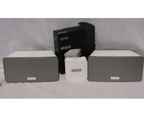 Sonos: pair of Play 3 interactive speakers, with a Sonos bridge connection system. All electrical items in this lot have been