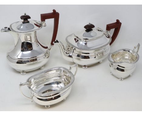 Silver plated four piece tea and coffee service with mahogany handles and finials to tea and coffee pot, largest H: 20 cm. UK