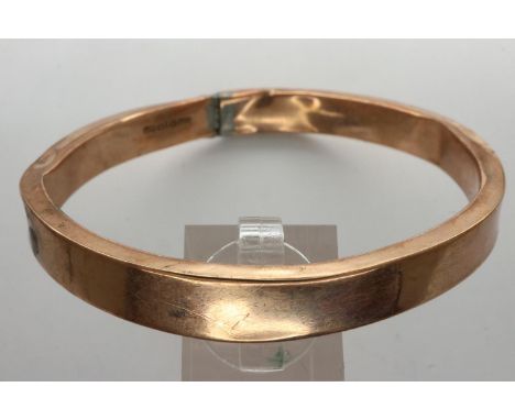 9ct rose gold bangle with metal core, D: 70 mm, 150g, slightly dented with solder repair. UK P&amp;P Group 1 (£16+VAT for the