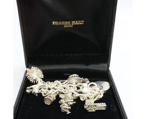 Hallmarked silver charm bracelet with seven charms, padlock clasp and safety chain, L: 18 cm, 47g. UK P&amp;P Group 1 (£16+VA