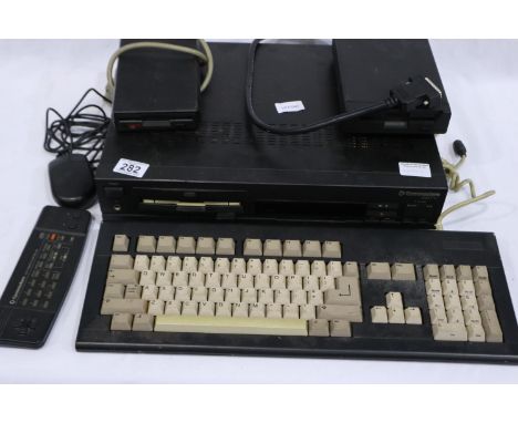 Commodore CDTV computer system, working and boots, with keyboard, mouse, remote and two external disk drives, CD drive does n