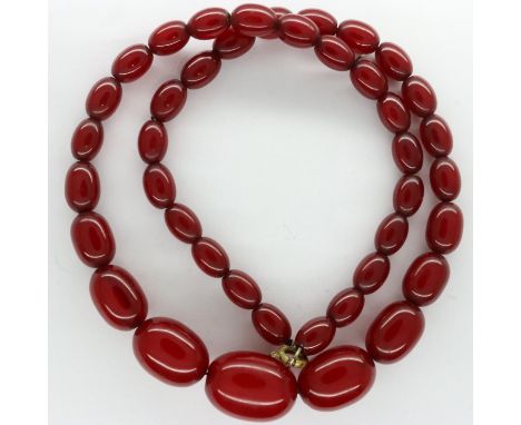 Cherry amber beaded necklace, L: 46 cm, largest bead L: 20 mm. UK P&amp;P Group 1 (£16+VAT for the first lot and £2+VAT for s