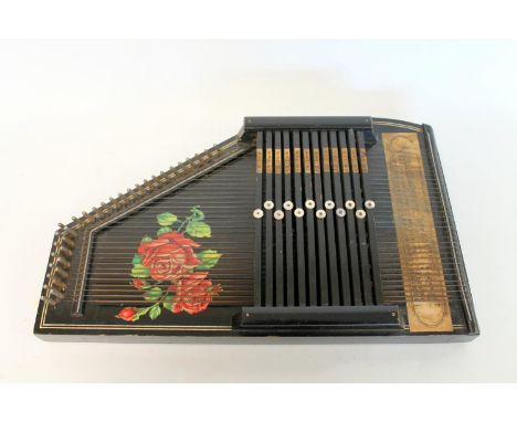 Late 19th century/early 20th century Auto harp zither the ebonised case with rose panel. 52cm long. Slight worm. 
