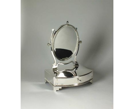 An Edwardian silver dressing table mirror, William Comyns, London 1902, designed as a silver mounted single drawer bow fronte