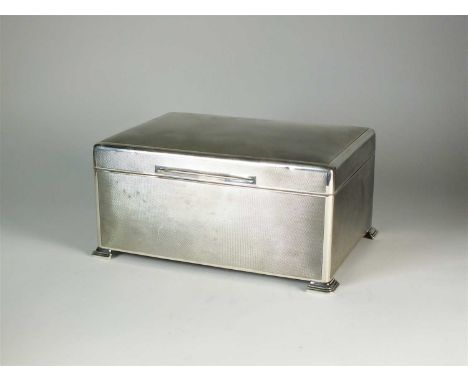 A large silver mounted cigar box, Dudley Russell Howitt, Birmingham 1946, of rectangular form with engine turned decoration, 