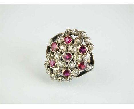 A 19th century style diamond and ruby ring, designed as twenty-two graduated old cut diamonds and seven mixed cut rubies all 
