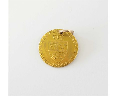 A George III half spade guinea, dated 1788, ref Spink 3735 (pierced with jump ring)