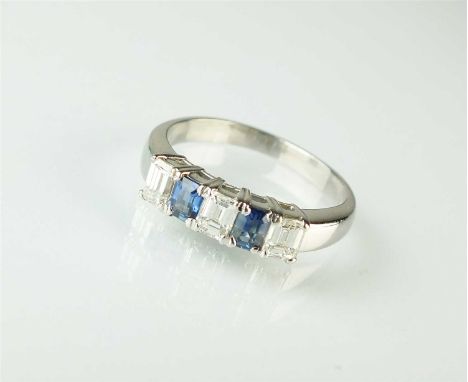 A five stone diamond and sapphire ring, designed as three rectangular faceted cut diamonds interspersed with two faceted sapp