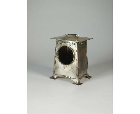 A Liberty &amp; Co Cymric silver clock case, Birmingham 1903, of plain polished form with stylised riveted borders, bracket h