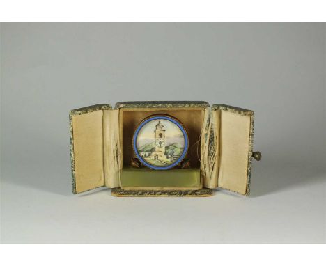 A cased travelling timepiece, of circular form depicting printed scene of a clock tower, the top of the tower with cut apertu