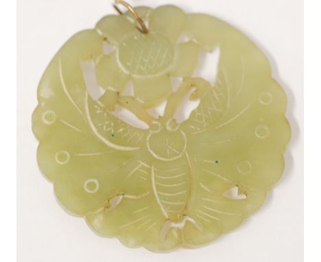 CHINESE CARVED AND PIERCED MUTTON FAT JADE DISC PENDANT, in thee form of a  butterfly and a flower, double sided, 2 1/8" 