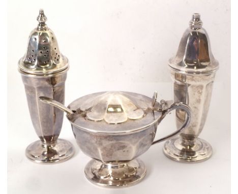THREE PIECE PEDESTAL SILVER CONDIMENT SET AND SPOON by Edward Viner, of panelled form, the lidded MUSTARD wit blue glass line