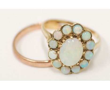 9CT gold and opal cluster ring, CENTRAL CABOCHON OPAL AND SURROUND OF 12 OPAL BEADS AND A 9ct GOLD PLAIN WEDDING RING, 5gms g