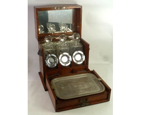 LATE VICTORIAN OAK TANTALUS BOX, with hinged lid with interior mirror, fall front fitted with a drawer compartmented for ciga