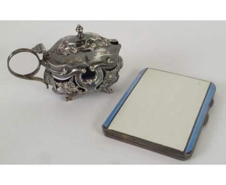 A LATE VICTORIAN SILVER MUSTARD POT  with blue glass liner, stamped and pierced in neo-rococo  taste, Chester 1899, also a SI
