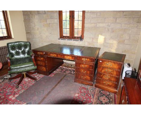 A large pedestal desk with inset leather writing surface, green leather chair and matching filing cabinet, desk 76 cm x 182 c