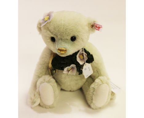 A boxed Steiff Christmas Rose teddy bear, limited edition no 733 of 1500, model no 36736, with outer card packaging.