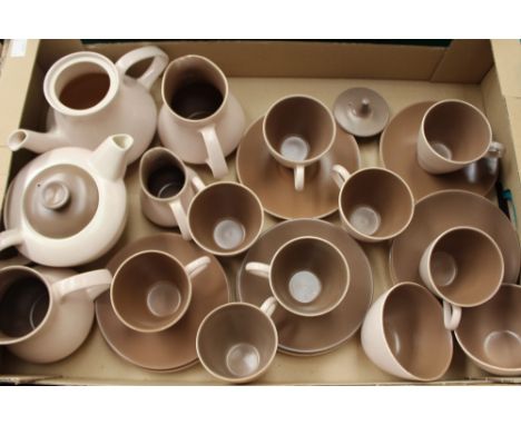 A Poole pottery tea and coffee set, in beige and coffee brown, comprising teapot, hot water pot, milk jug, cream jug, two sug
