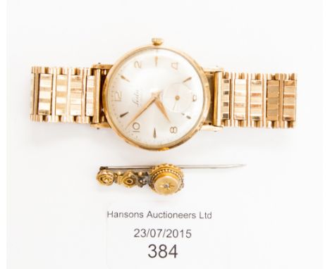 A 9ct gold Lada 17 jewelled gentlemen's wristwatch and a stick pin 