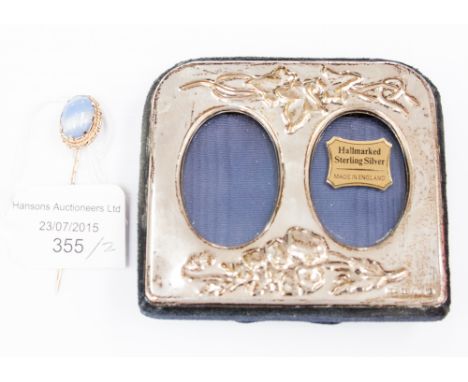 A silver double photo frame in the Art Nouveau style PJP, 1994, Birmingham; together with a stick pin, marked 9ct, set with c