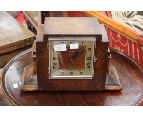 An Art Deco oak cased mantle clock, with an eight day movement and Westminster chime 