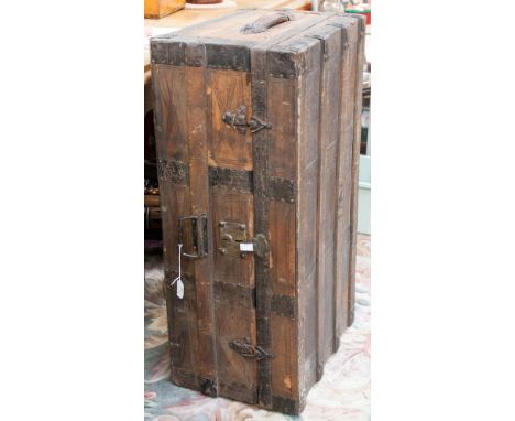 A late 19th/early 20th Century leather coated wooden and iron bound travelling trunk.